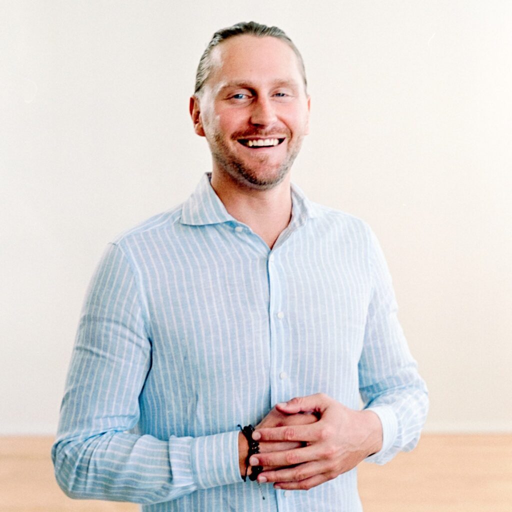 Professional headshot of Dr. Kolby Ourada, co-founder of Haven Holistic Health, smiling confidently.